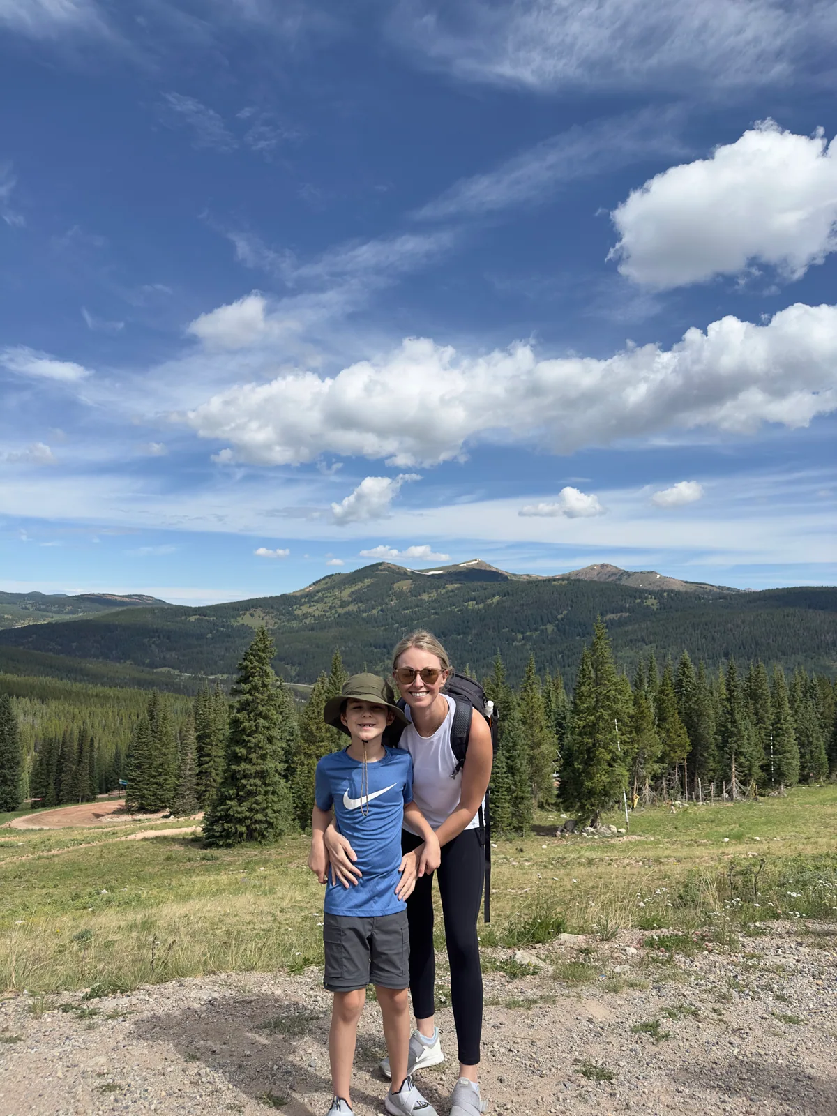 Dr. Natalie Smith hiking with her son in the mountains